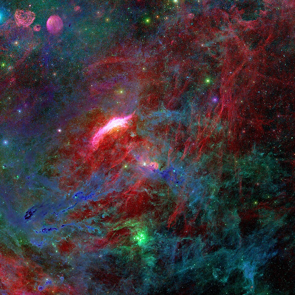 The region surrounding the California Nebula, as seen by the Northern Sky Narrowband Survey. The California Nebula (bright pinkish object in the center) appears to be the brightest part of a much larger structure (red) that is partially obscured by molecular clouds in Taurus and Perseus.