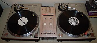 Set of Technics 1200 turntables with a Vestax PMC-06 Pro A mixer