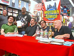 Writers of Marvel titles in the 2010s include (seated left to right) Ed Brubaker, Christos Gage, Matt Fraction, and Brian Michael Bendis.