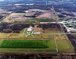 The Lake Ontario Ordnance Works (LOOW) near Niagara Falls became a principal repository for Manhattan Project waste for the Eastern United States.[362] All of the radioactive materials stored at the LOOW site—including thorium, uranium, and the world's largest concentration of radium-226—were buried in an "Interim Waste Containment Structure" (in the foreground) in 1991.[363][364][365]