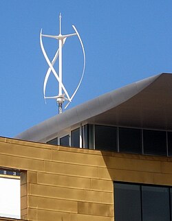 A small Quietrevolution QR5 Gorlov type vertical axis wind turbine on the roof of Bristol Beacon in Bristol, England. Measuring 3 m in diameter and 5 m high, it has a nameplate rating of 6.5 kW.