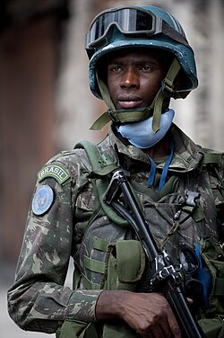 Brazilian soldier stands security in Port-au-Prince
