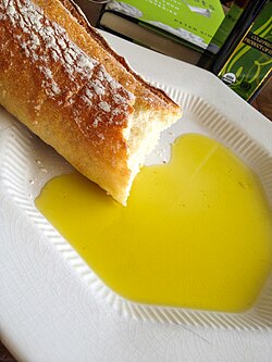Extra virgin olive oil and baguette, often considered a symbol of French culture
