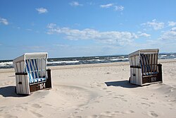 The strandkorb became a symbol of seaside tourism by the end of the 19th century, especially on the southern Baltic Sea coast