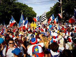 Acadians celebrating the Tintamarre and National Acadian Day in Caraquet, New Brunswick