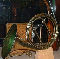 A natural horn has no valves, but can be tuned to a different key by inserting different tubing, as during a rest period.