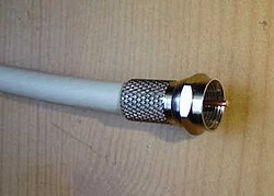 A coaxial cable used to carry cable television to the subscribers' premises