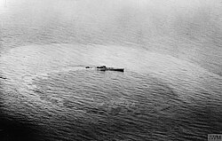 U-459, a Type XIV supply submarine (known as a "milch cow") sinking after being attacked by a Vickers Wellington