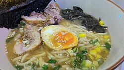 Japanese miso ramen garnished with edible seaweed, sesame and scallion
