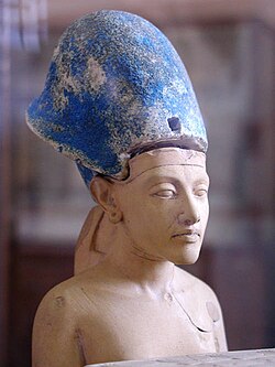Small statue of Akhenaten wearing the Blue Crown