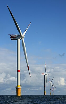 Wind is a natural resource that can be used to generate electricity, as with these 5 MW wind turbines in Thorntonbank Wind Farm 28 km (17 mi) off the coast of Belgium.