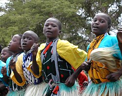 Kenyan boys and girls performing a traditional dance