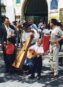 Street musicians in Caracas play joropo on the Venezuelan arpa
