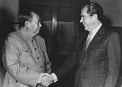 General Secretary Mao Zedong (left) shakes hands with President Richard Nixon (right) during the latter's visit to China in 1972.