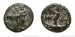 A Bronze coin from Tyre from the time of Hadrian, depicting Tyche (left) and Astarte on a galley holding a crown in her right hand and a scepter in her left hand (right)[121]