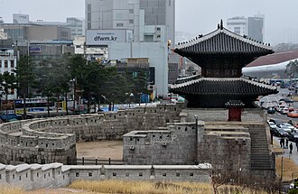 This is an example of a walled city gate. A smaller wall protects the entry into the city gate. Dongdaemun, Seoul, the East Gate, built in 1398.