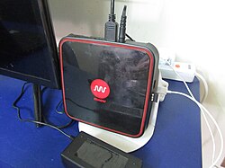 An IPTV set-top box connected to a TV set, designed to receive television from a service called Mview