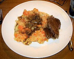 Hutspot with beef stew on plate