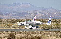 EZ-Rocket, flown by Dick Rutan, touches down at California City, California on December 3, 2005, setting a point-to-point distance record for rocket-powered, ground-launched aircraft.