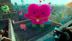 A scene from the Maxident trailer in which heart-shaped monsters appear in front of Stray Kids.