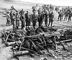 Eisenhower, Bradley and Patton inspect a cremation pyre at the Ohrdruf concentration camp on 12 April 1945, after liberation.