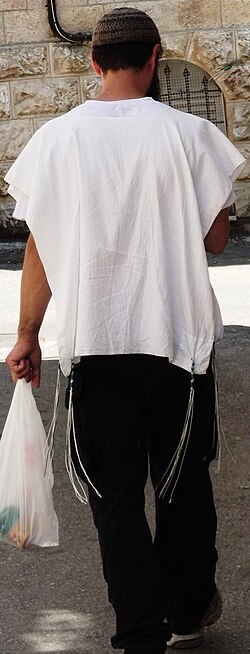 Man walking with Tzizit in Nachlaot, Jerusalem