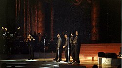 Carey performing "One Sweet Day" with Boyz II Men at Madison Square Garden in October 1995