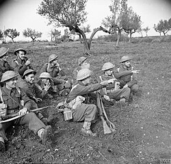 Men of the 5th Battalion, Queen's Own Royal West Kent Regiment in an olive grove, Italy, 16 December 1943.