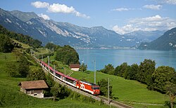 Zentralbahn Interregio train following the Lake Brienz shoreline, near Niederried in Switzerland