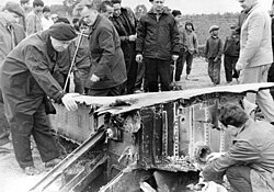 Soviet advisers inspecting the debris of a B-52 downed in the vicinity of Hanoi