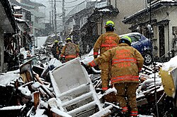 VA-TF1 Rescue team from Fairfax County, Virginia searching for survivors in Kamaishi, Iwate Prefecture. Snow arrived minutes before or after the tsunami, depending on locations.[40]