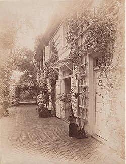Roses on the front trellis of Wyck c. 1900, facing southwest.