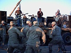 The Vandals performing for US troops in Baghdad in December 2004, with substitute drummer Byron McMackin.