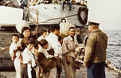 Refugees from the Korean War boarding the USS Weiss, September 16, 1952.