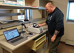 A nurse at McMurdo Station sets up polymerase chain reaction (PCR) testing equipment in September 2020.