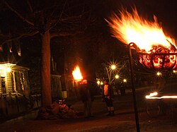 In the tradition of a "grand illumination", fires are used to light the street in Colonial Williamsburg.