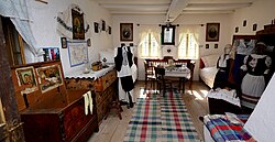Folk costumes and interior fabrics on display at the Banat Village Museum