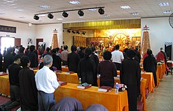 Lay Buddhists at the recitation hall of the Temple of the Six Banyan Trees in Guangzhou.