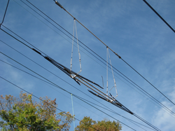 A section insulator at a section break in Amtrak's 12 kV catenary