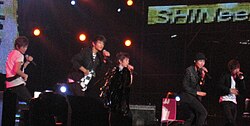 Shinee in February 2009 performing at Rajamangala Stadium in Bangkok.