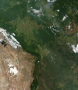 Satellite image of Bolivia: The western region is defined by the Andes Mountains and the Altiplano plateau, whereas the eastern region is characterized by the extensive lowland plains of the Amazon Basin.