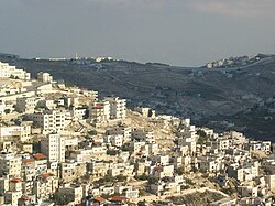 East Jerusalem, with Israeli West Bank barrier in the background