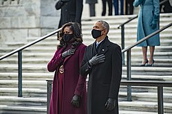 Obama attending a wreath laying ceremony with her husband at the Tomb of the Unknown Soldier in Arlington National Cemetery after the Inauguration of Joe Biden in 2021