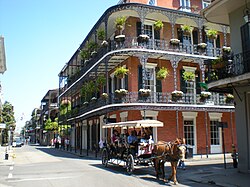 Elaborate ironwork galleries on the corner of Royal and Dumaine streets (featured are the Miltenberger Houses)