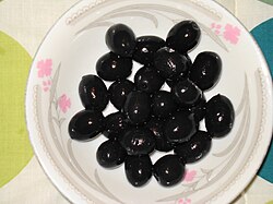 Black olives on a plate