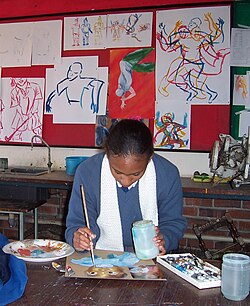 A student works on a school project at Gateway High School in Zimbabwe.