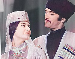 An Adyge woman and man in traditional clothing