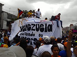 Student representatives speaking to the crowd during a college march in Caracas, Venezuela in 2013.