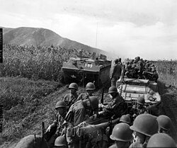 LVTs carrying U.S. and South Korean marines wait to cross the Han River