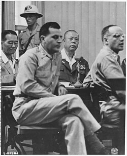 General Tomoyuki Yamashita (2nd right) on trial in 1945 by a U.S. military commission for the Manila massacre and other violations which were committed in Singapore. He was sentenced to death. The case set a precedent (the "Yamashita Standard") on the responsibility of commanders for war crimes.